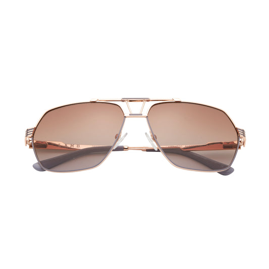 L.A.M.B. LA577 RGD sunglasses with a geometric aviator rose gold metal frame, gradient brown lenses, signature cutout bridge design, and sleek striped temples with grey temple tips. Front view.