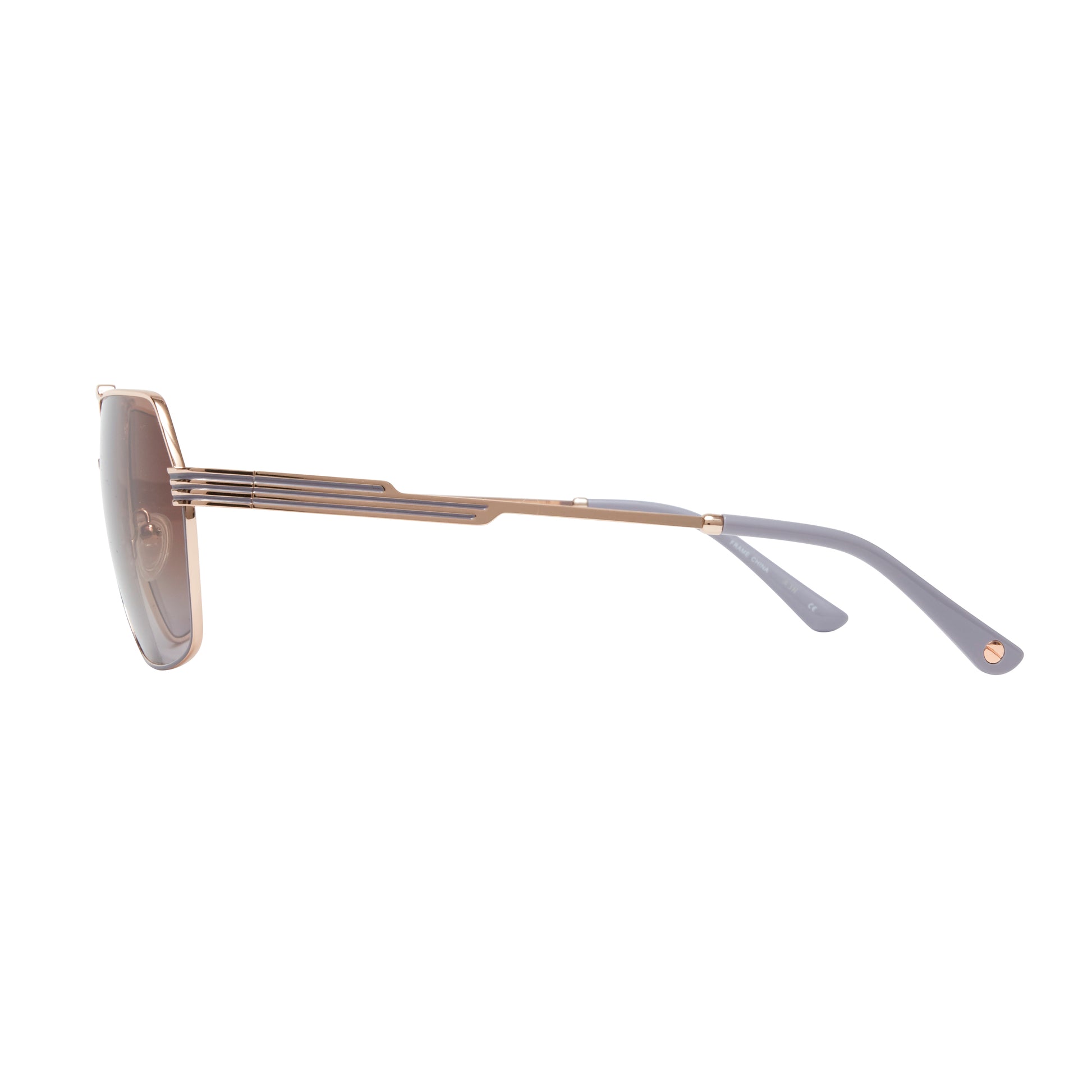 L.A.M.B. LA577 RGD sunglasses with a geometric aviator rose gold metal frame, gradient brown lenses, signature cutout bridge design, and sleek striped temples with grey temple tips. Side view.
