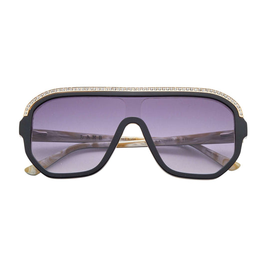 L.A.M.B. LA593 BLK shield-style sunglasses with black and bone acetate, crystal inlays, gold detailing, smoke fade lenses, UV400 protection, size 132-0-140