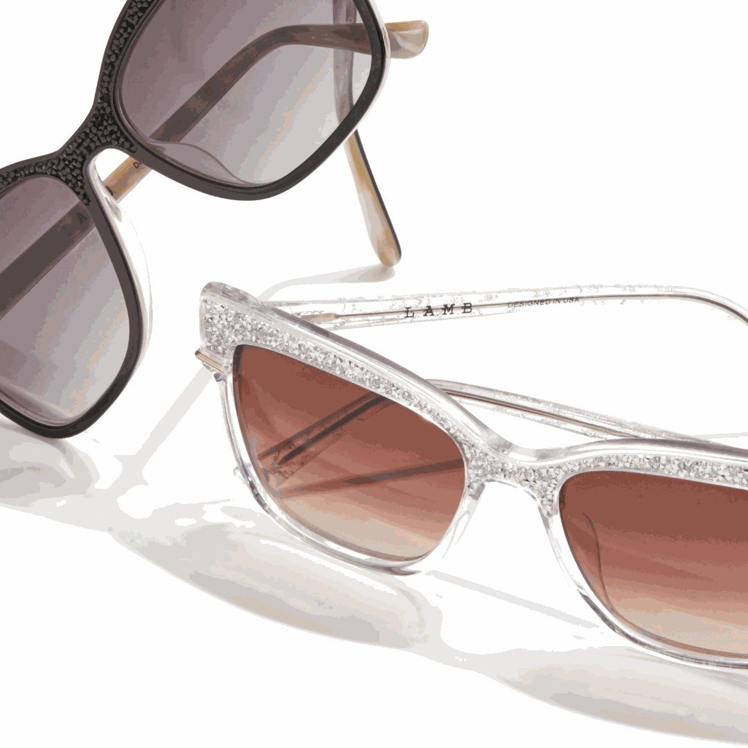 L.A.M.B. LA596 CRY Sunglasses with crystal acetate frame, silver details, and UV400 protection.