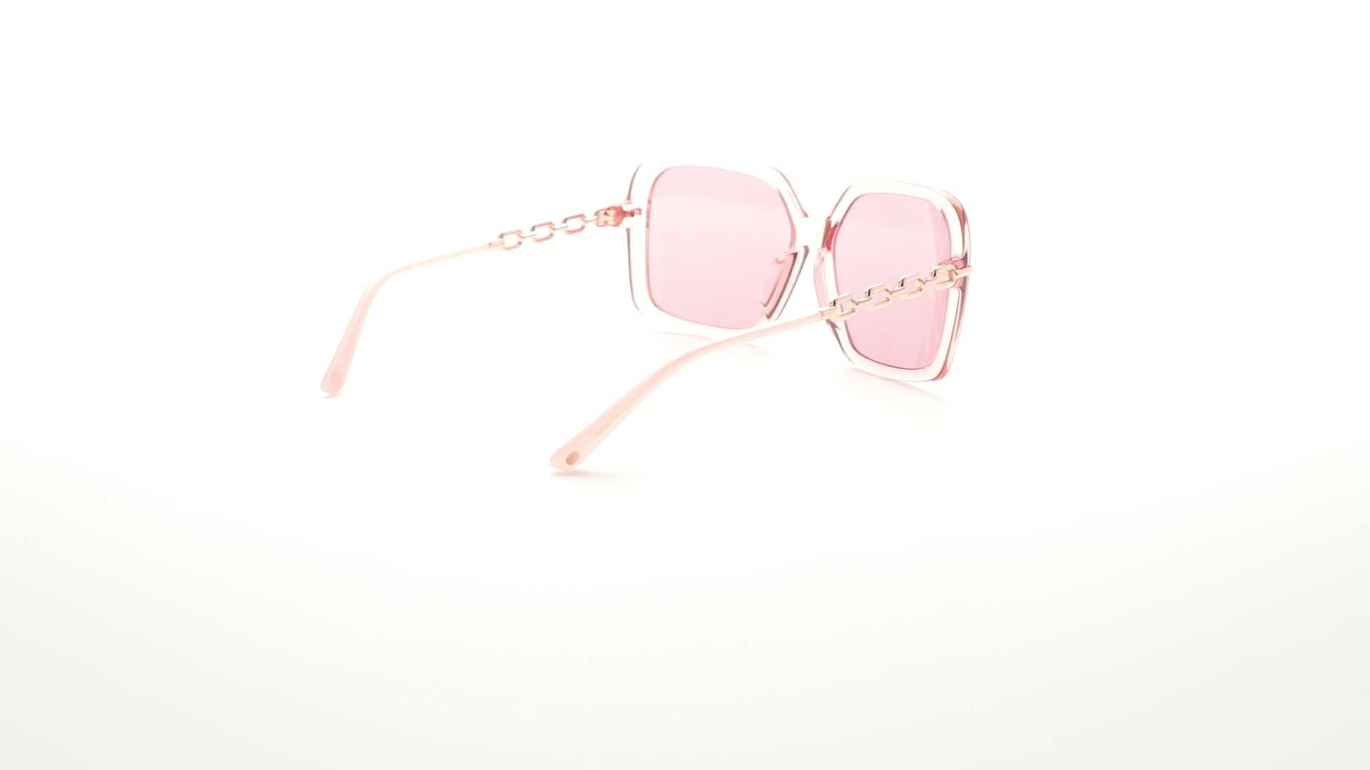 L.A.M.B. LA599 blush sunglasses – bold square frames with pink lenses and rose gold chain-link temples, statement eyewear designed in the USA. 360 view.