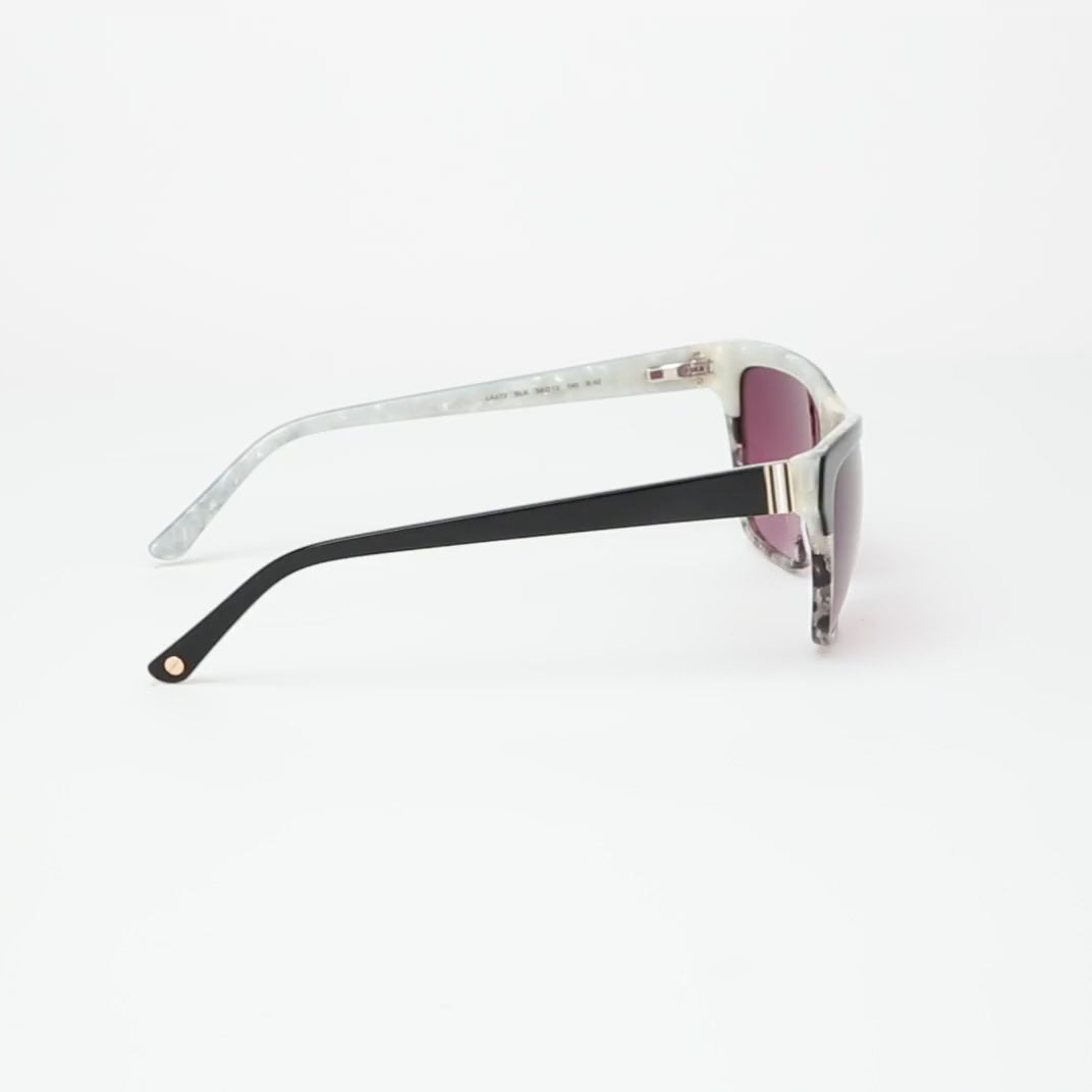 L.A.M.B. LA573 BLK sunglasses with a bold square frame, featuring a sleek black upper, marbled lower rims, and gradient burgundy lenses, accented by a signature gold stripe detail at the bridge. 360 view