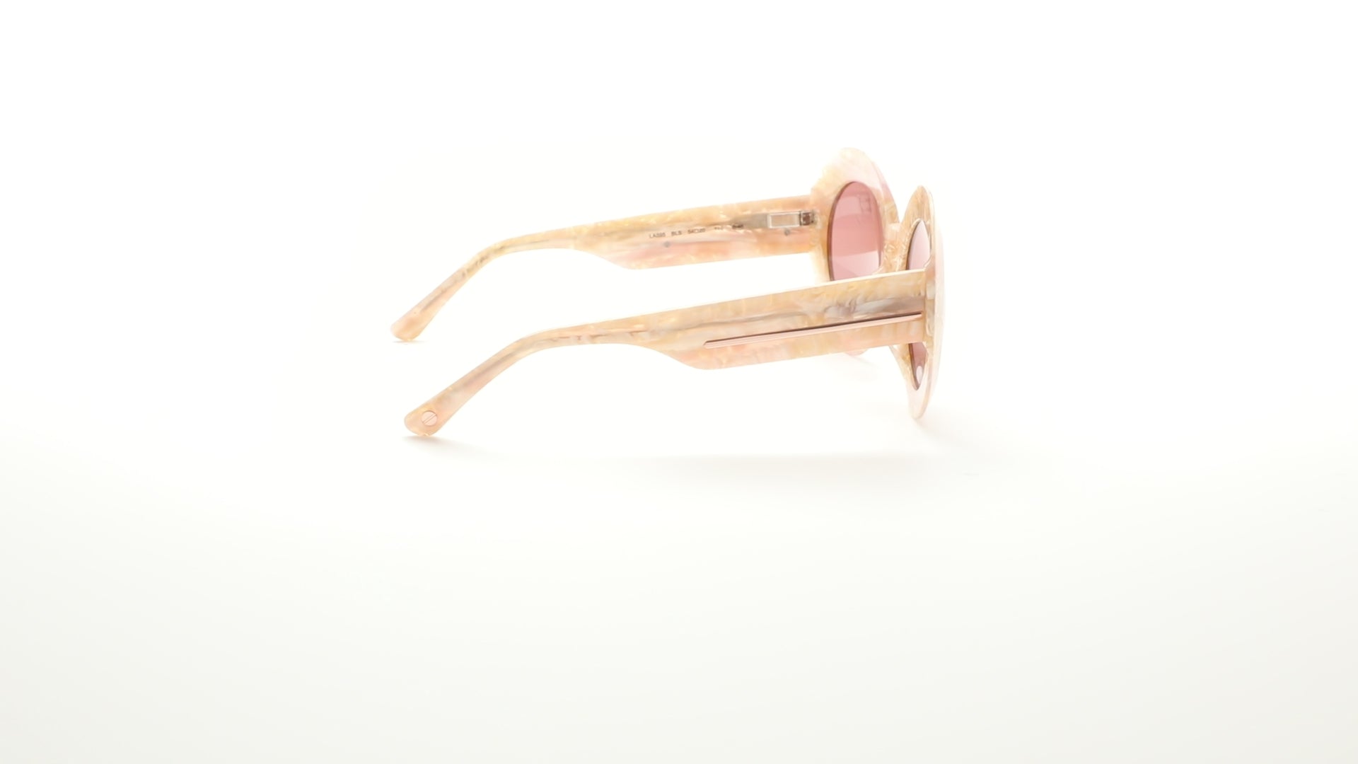 L.A.M.B. LA595 BLS sunglasses – bold round-frame eyewear in a blush-toned marbled acetate with rose lenses. Retro-inspired designer shades by Gwen Stefani, perfect for fashion-forward sun protection and standout style. 360 view.