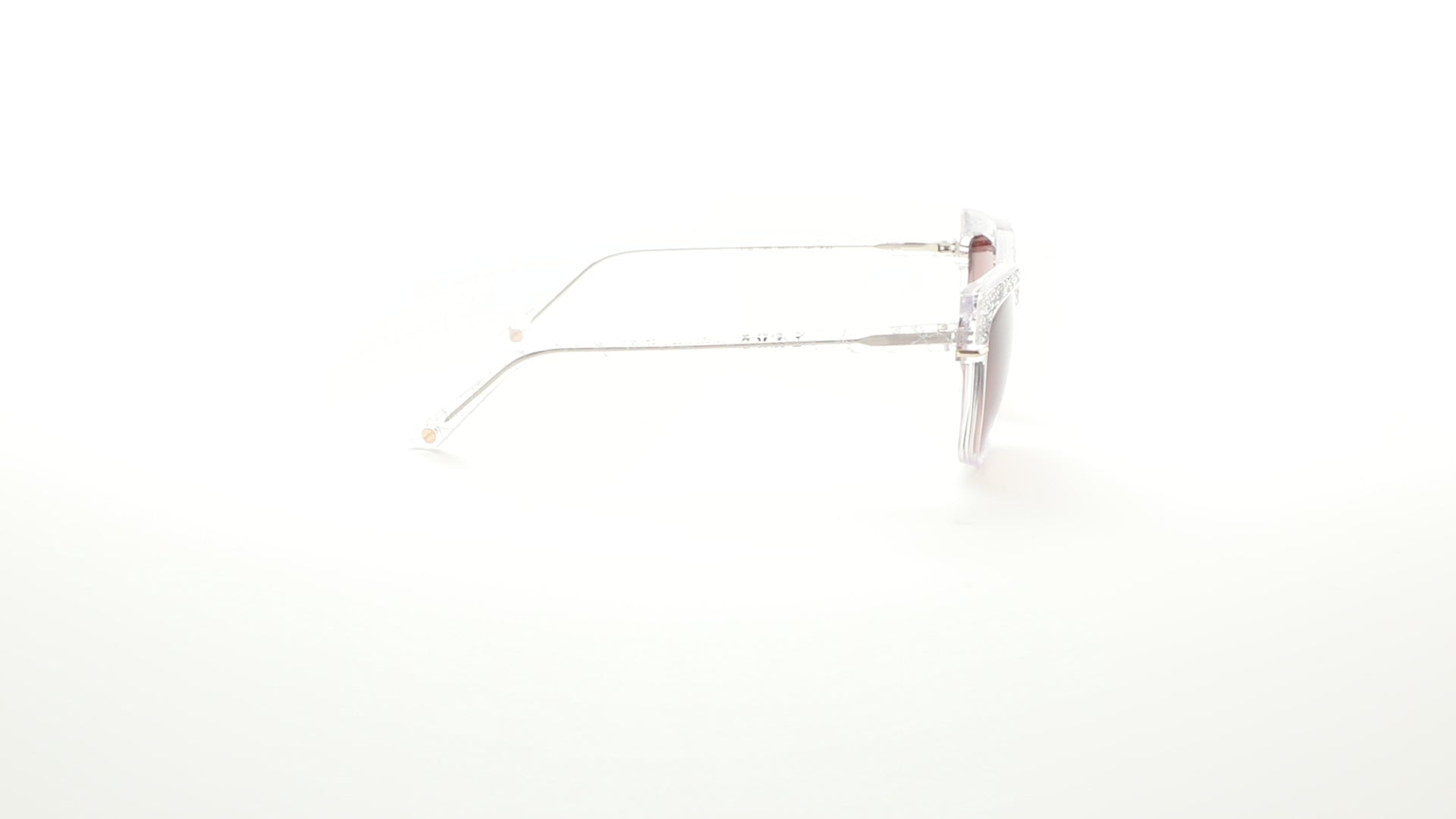 L.A.M.B. LA596 CRY cat-eye sunglasses with crystal clear frames and gradient lenses. 360 view.