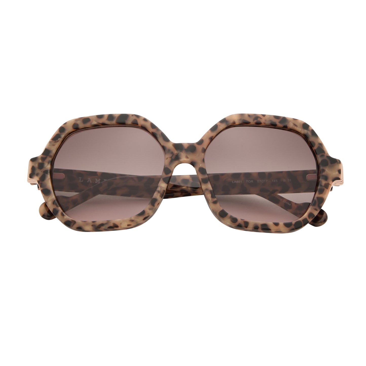 Front view of L.A.M.B. LA601 TOR Sunglasses featuring oversized tortoise frame, gold detailing, brown to blush gradient lenses, luxury acetate, size 57-17-145.