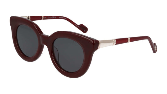 L.A.M.B. LA603 BUR Sunglasses in burgundy acetate with slate gray lenses and rose gold metal detailing, round 48-22-140 frame designed by Gwen Stefani.