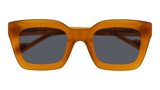 Front view of L.A.M.B. LA604 YEL Sunglasses in milky yellow acetate with smoke lenses and warm gold metal detailing, square 50-24-140 frame designed by Gwen Stefani.