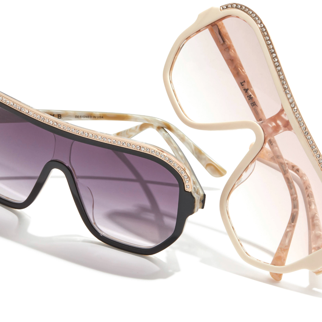 L.A.M.B. LA593 sunglasses in BLK and BON colorways – oversized shield-style frames with gradient lenses and rhinestone accents, bold fashion eyewear designed in the USA.