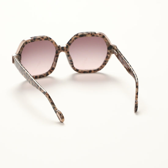 360-degree view of L.A.M.B. LA601 TOR Sunglasses in oversized tortoise acetate frame with elegant gold front detail and brown to blush gradient lenses, 100% UVA+UVB protection.