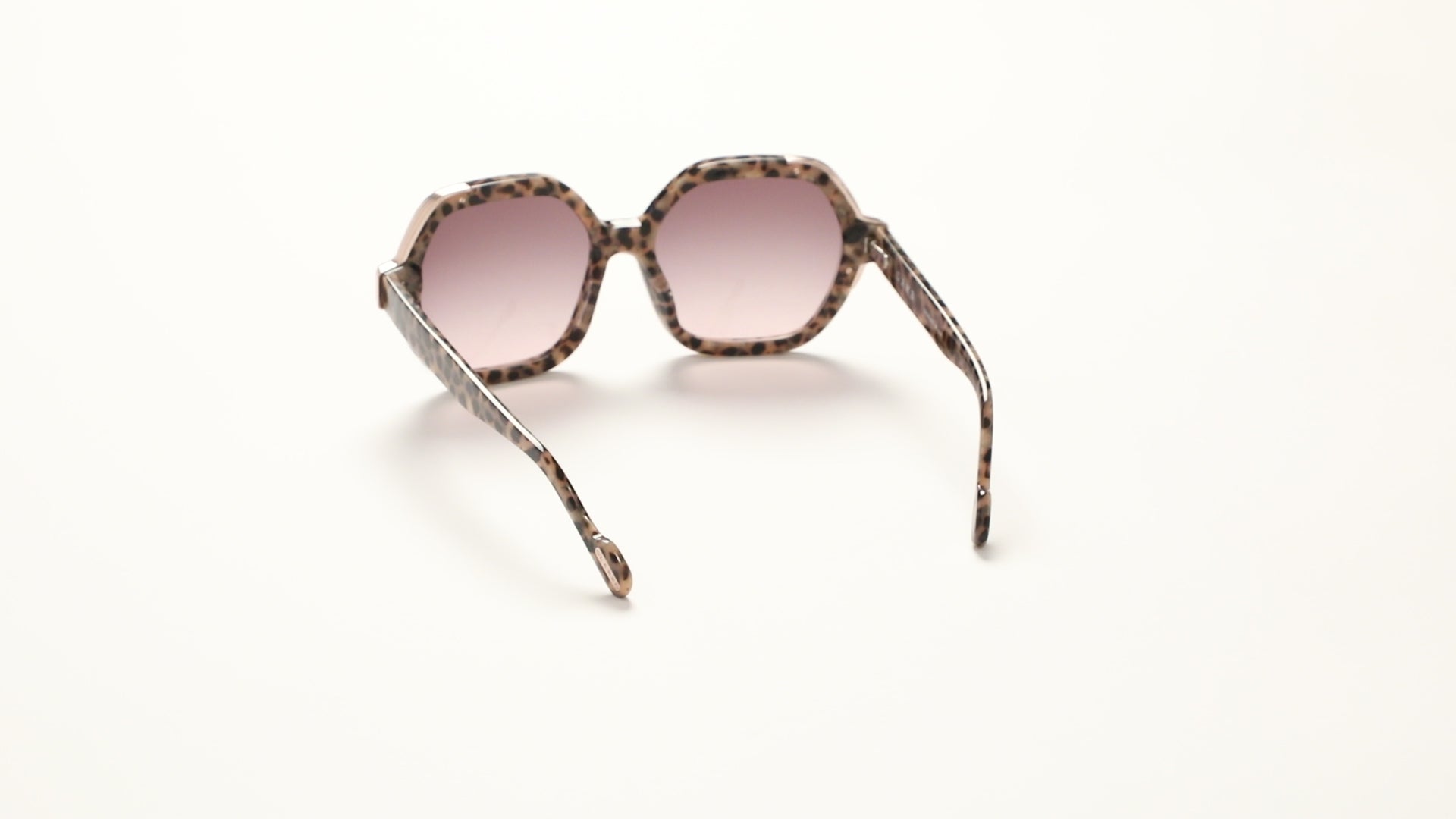 360-degree view of L.A.M.B. LA601 TOR Sunglasses in oversized tortoise acetate frame with elegant gold front detail and brown to blush gradient lenses, 100% UVA+UVB protection.