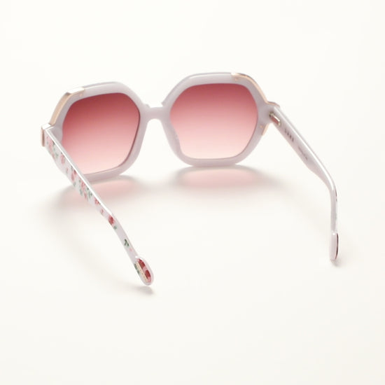 360-degree view of L.A.M.B. LA601 WHT Sunglasses by Gwen Stefani, oversized white floral acetate frame with elegant gold front detail, burgundy gradient lenses, 100% UVA+UVB protection.