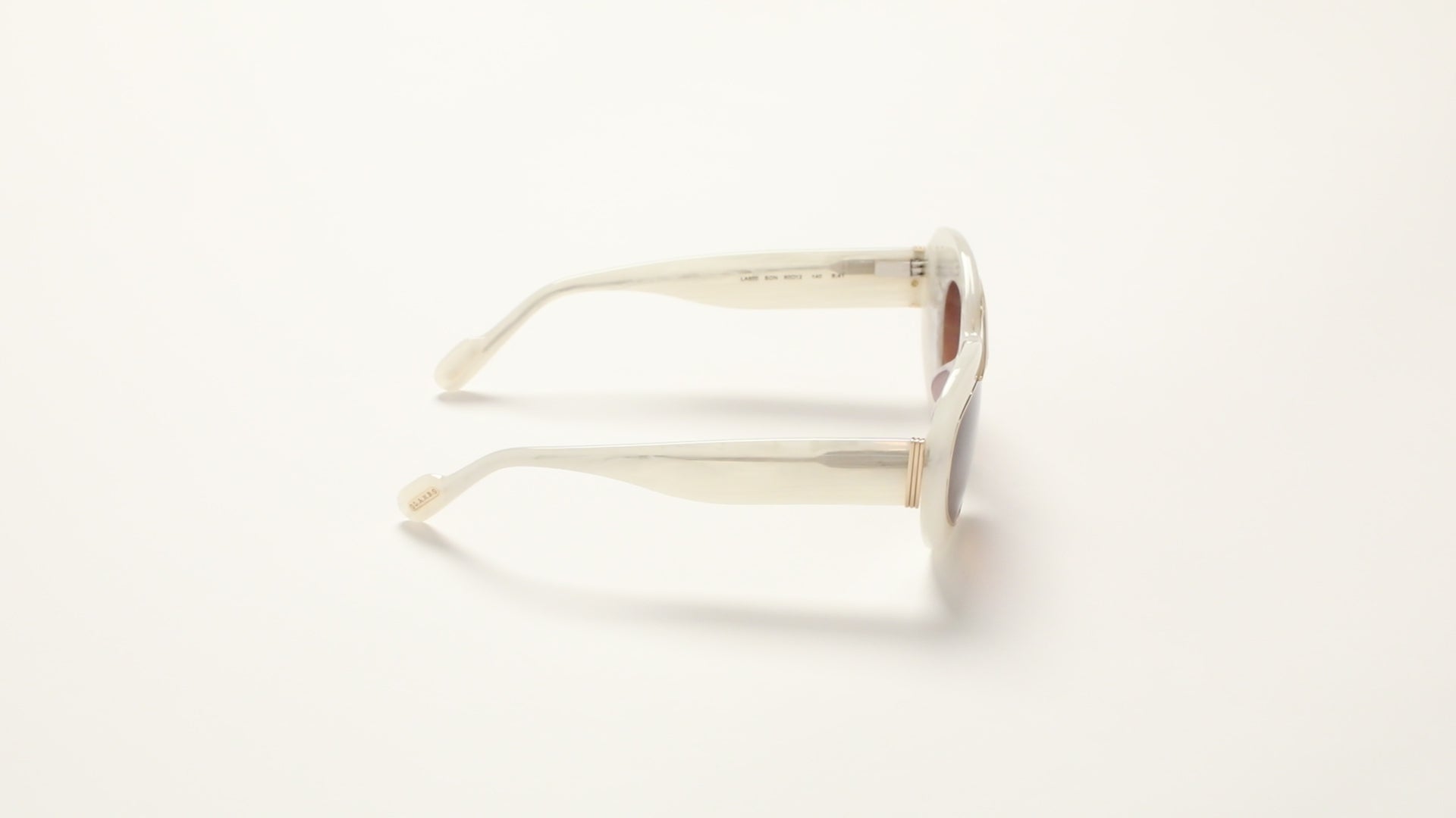 360 degree video of Pearl Marble sunglasses with brown gradient lenses on a white background